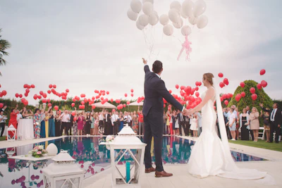 Colorful balloon release at a joyful outdoor Texas wedding celebration